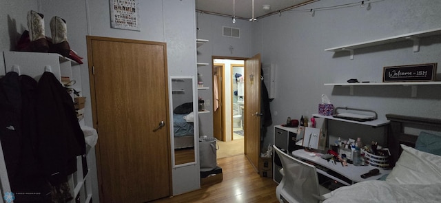interior space featuring visible vents and wood finished floors