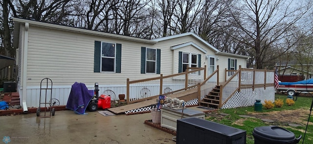 24744 Mound Rd, Dane Prairie Twp, MN 56537 - rear view of house featuring central air condition unit, a deck, a patio, and stairway