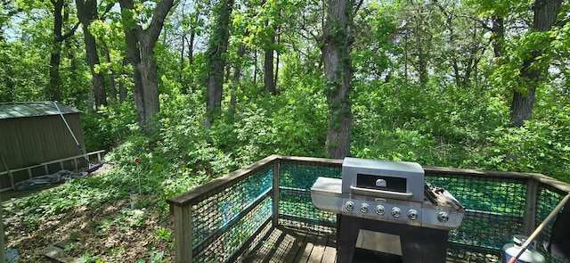 24744 Mound Rd, Dane Prairie Twp, MN 56537 - deck with area for grilling and a view of trees