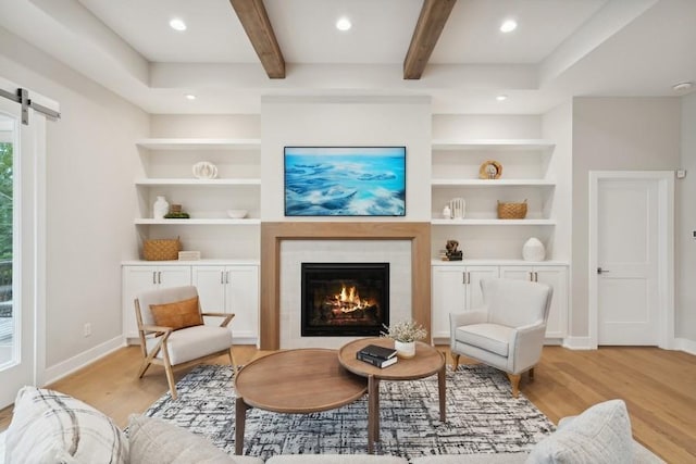 14237 Mckenna Rd NW, Prior Lake, MN 55372 - sitting room with recessed lighting, baseboards, light wood-style flooring, and beam ceiling