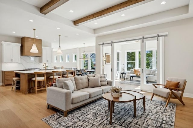 14237 Mckenna Rd NW, Prior Lake, MN 55372 - living area featuring recessed lighting, beamed ceiling, light wood-type flooring, and a barn door