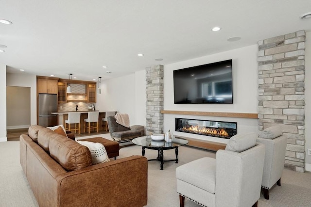 14237 Mckenna Rd NW, Prior Lake, MN 55372 - living area featuring recessed lighting, a glass covered fireplace, and light carpet