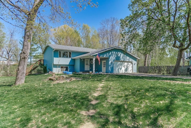 tri-level home with a garage and driveway