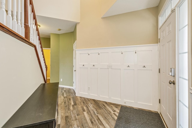 foyer with stairs and light wood-style floors