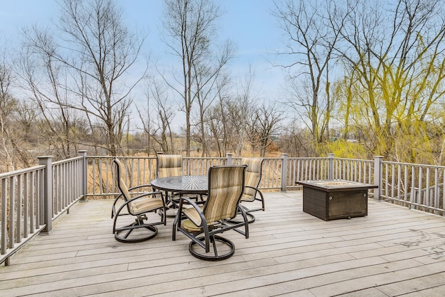 wooden deck featuring outdoor dining space