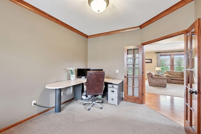 office featuring crown molding, baseboards, french doors, and a textured ceiling