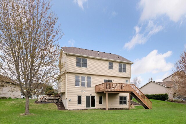 back of house with stairway, a yard, and a wooden deck
