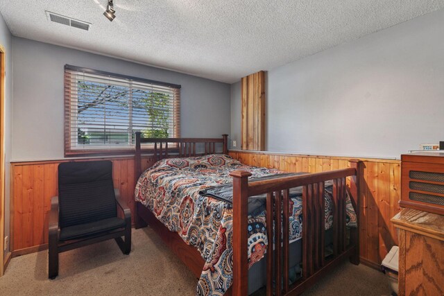 20170 Dunbar Ave, Farmington, MN 55024 - carpeted bedroom with a wainscoted wall, wooden walls, and a textured ceiling