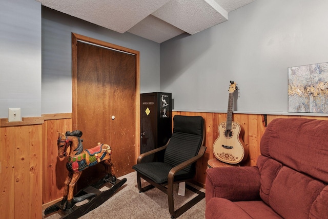 20170 Dunbar Ave, Farmington, MN 55024 - living area featuring carpet, a wainscoted wall, wood walls, and a textured ceiling