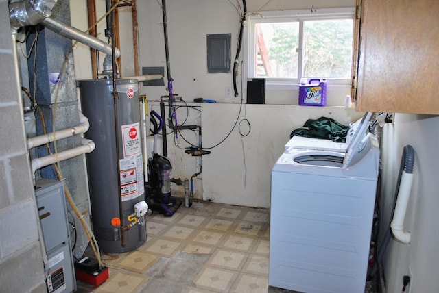 washroom with laundry area, tile patterned floors, water heater, washing machine and dryer, and electric panel