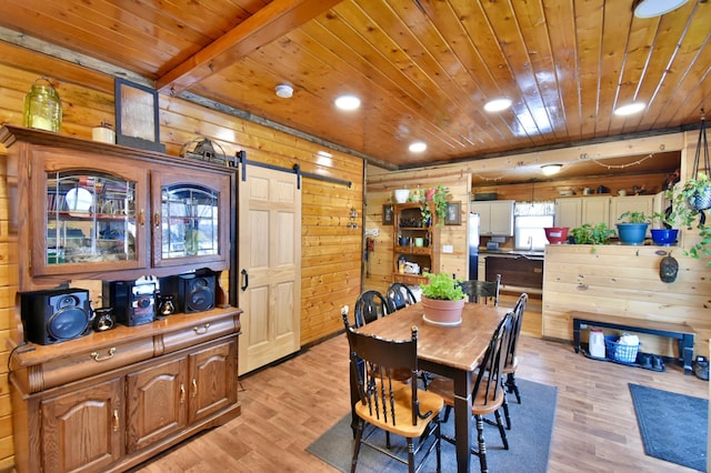 23182 US Highway 169, Milaca, MN 56353 - dining area featuring wood ceiling, light wood finished floors, a barn door, wood walls, and recessed lighting
