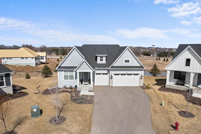 view of front of house with a garage and aphalt driveway