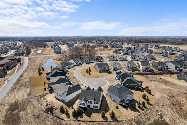 birds eye view of property with a residential view