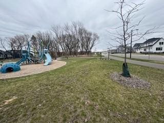 view of community with a lawn and playground community