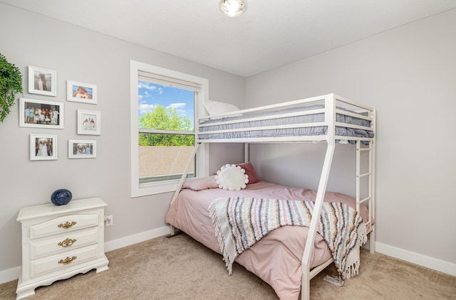 carpeted bedroom with baseboards