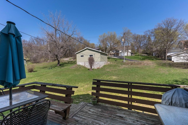 312 Vine St, Fergus Falls, MN 56537 - wooden terrace with outdoor dining area, an outdoor structure, and a lawn