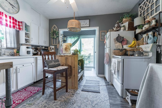312 Vine St, Fergus Falls, MN 56537 - kitchen with open shelves, white cabinets, dark wood-style flooring, ceiling fan, and white electric range