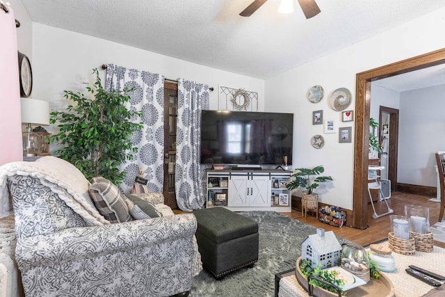 312 Vine St, Fergus Falls, MN 56537 - living area with a ceiling fan, baseboards, and wood finished floors