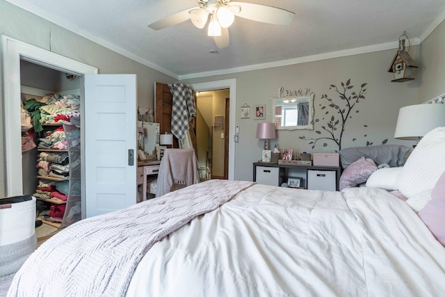 312 Vine St, Fergus Falls, MN 56537 - bedroom featuring a ceiling fan, ornamental molding, a closet, and a walk in closet