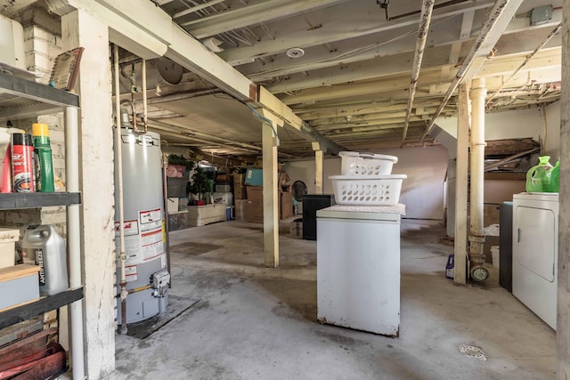 312 Vine St, Fergus Falls, MN 56537 - unfinished below grade area featuring independent washer and dryer and gas water heater