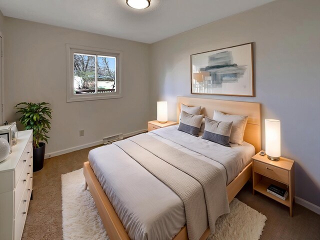 bedroom featuring carpet flooring and baseboards