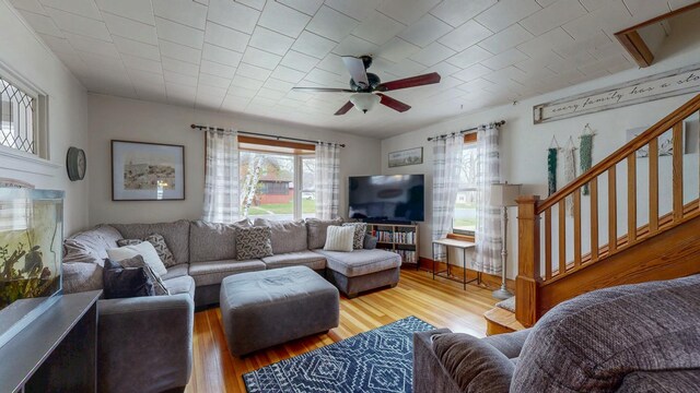 621 Fillmore St SE, Chatfield, MN 55923 - living room featuring plenty of natural light, a ceiling fan, stairs, and wood finished floors
