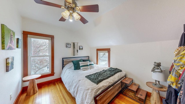 621 Fillmore St SE, Chatfield, MN 55923 - bedroom with hardwood / wood-style flooring, lofted ceiling, a ceiling fan, and baseboards