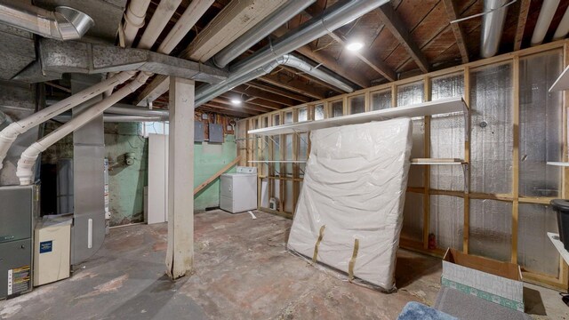 621 Fillmore St SE, Chatfield, MN 55923 - unfinished below grade area featuring washer / clothes dryer, electric panel, and heating unit