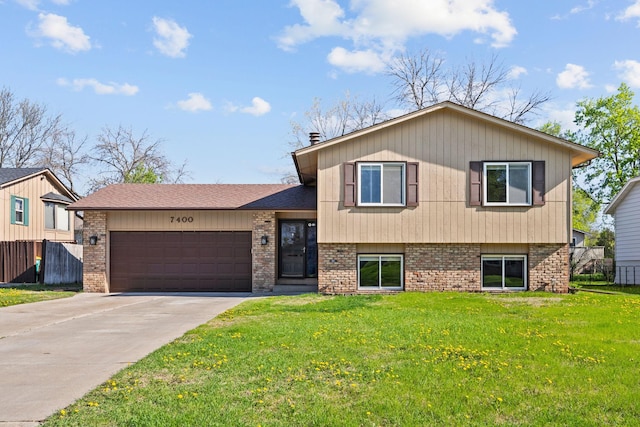 split level home featuring brick siding, a garage, driveway, and a shingled roof