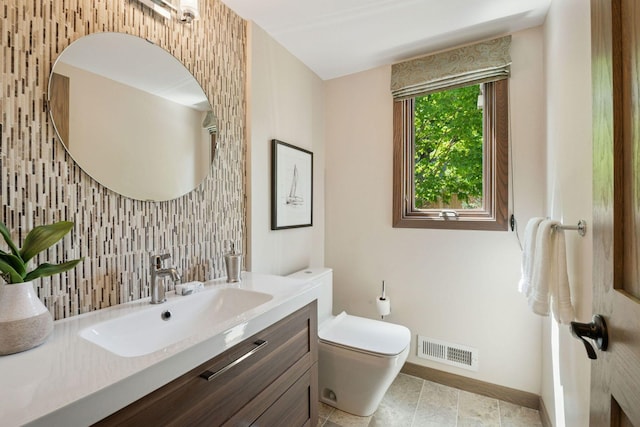 7000 Lanham Ln, Edina, MN 55439 - half bathroom with toilet, vanity, baseboards, and tasteful backsplash
