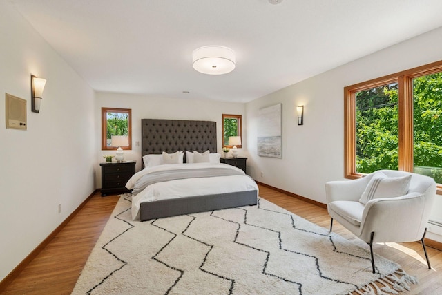 7000 Lanham Ln, Edina, MN 55439 - bedroom with light wood-style flooring and baseboards
