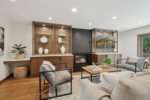 7000 Lanham Ln, Edina, MN 55439 - living room with light wood finished floors, recessed lighting, and a large fireplace