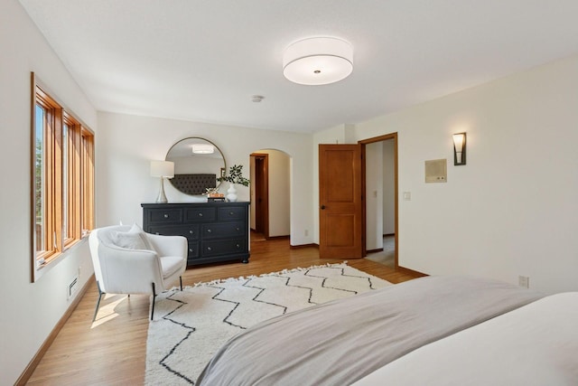 7000 Lanham Ln, Edina, MN 55439 - bedroom with light wood-type flooring and arched walkways
