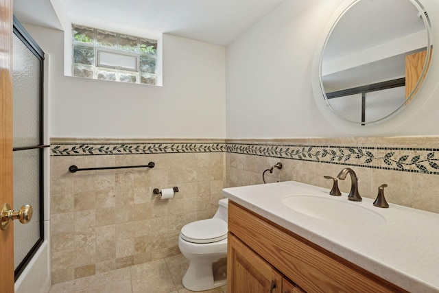 7000 Lanham Ln, Edina, MN 55439 - bathroom with vanity, tile walls, and a wainscoted wall