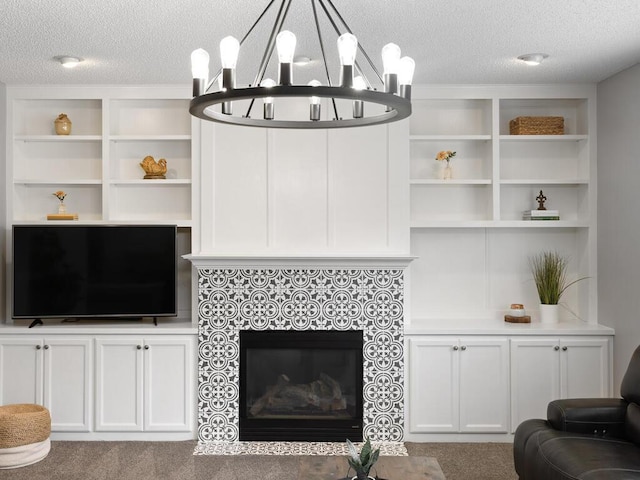 carpeted living room with a textured ceiling and a tiled fireplace