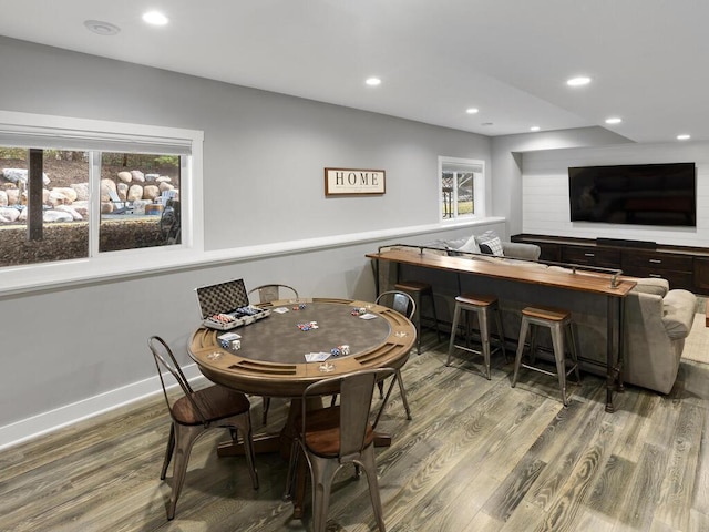 recreation room with recessed lighting, baseboards, and wood finished floors