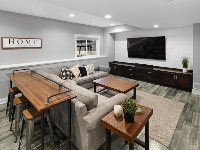 living room with recessed lighting, baseboards, and light wood-style floors