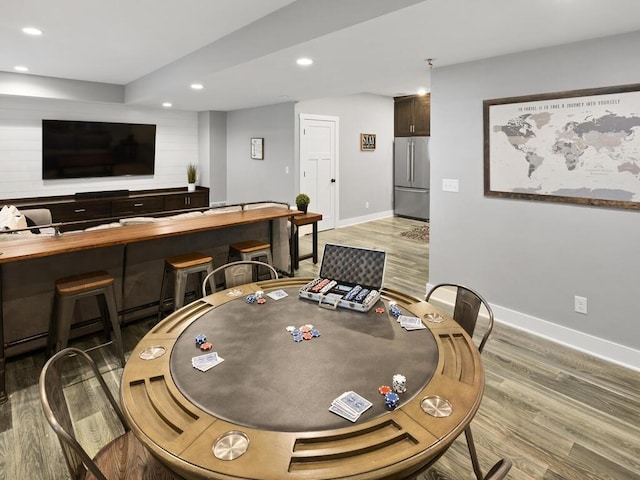 playroom with recessed lighting, light wood finished floors, and baseboards