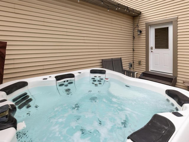 exterior space featuring a hot tub