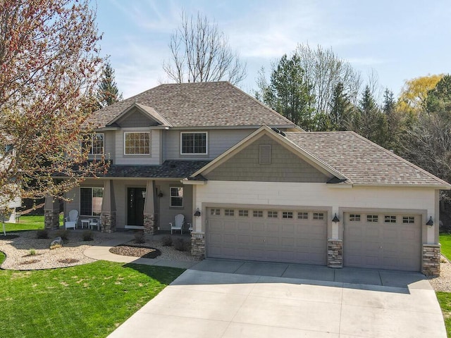 craftsman-style house with a garage, stone siding, covered porch, and driveway