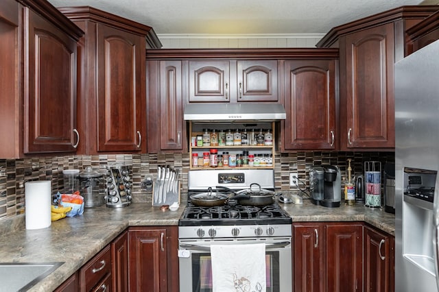 kitchen featuring under cabinet range hood, backsplash, and appliances with stainless steel finishes