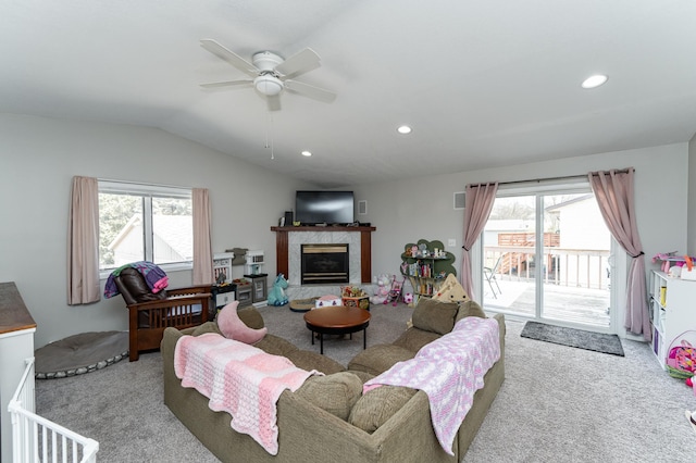 carpeted living room with plenty of natural light, a ceiling fan, recessed lighting, and lofted ceiling