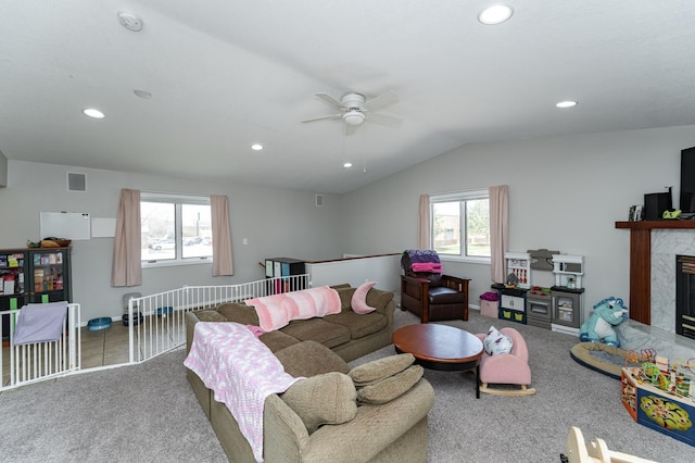 carpeted living room with a fireplace, a ceiling fan, and recessed lighting