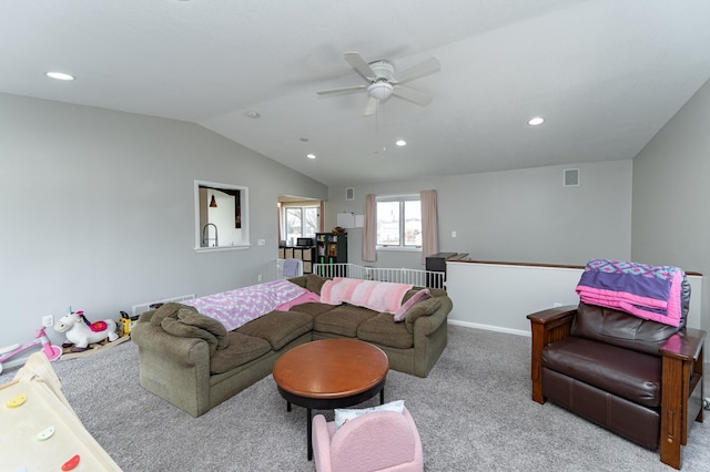 carpeted living room featuring a ceiling fan, visible vents, recessed lighting, and vaulted ceiling