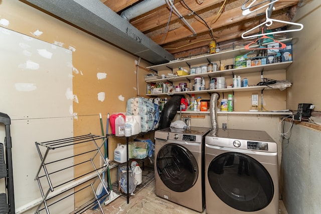 clothes washing area with laundry area and washing machine and clothes dryer