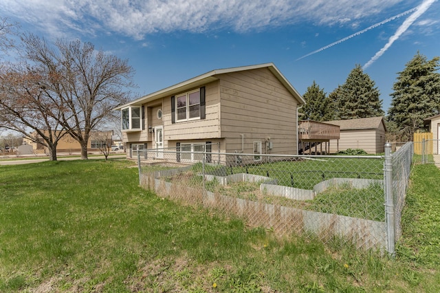 view of home's exterior featuring fence and a yard