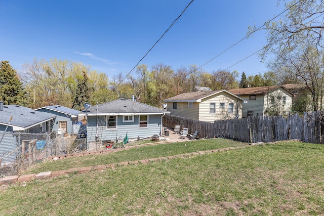 360 Hawthorne Ave E, Saint Paul, MN 55130 - rear view of property with a patio, fence, and a lawn