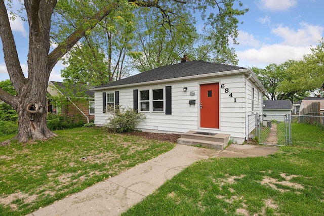 6841 Washburn Ave S, Richfield, MN 55423 - view of front of house with a gate and a chimney