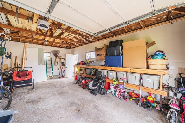 garage featuring a workshop area and a garage door opener