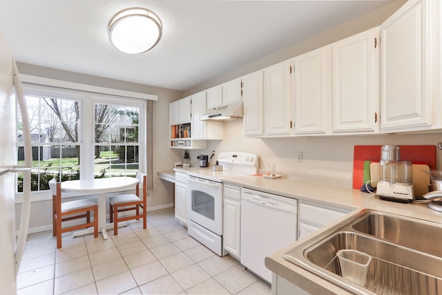 kitchen with a sink, white appliances, light countertops, white cabinetry, and under cabinet range hood